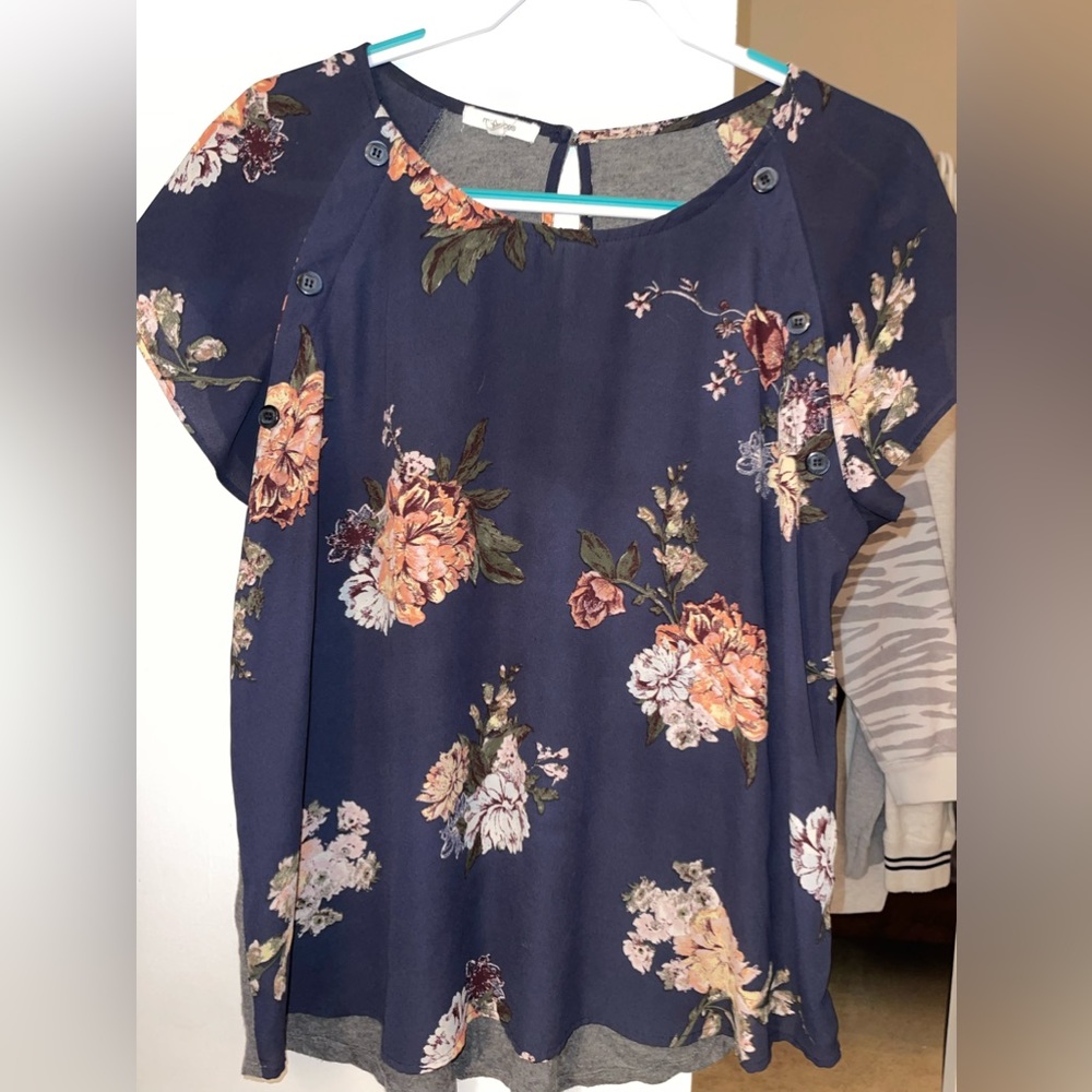 Navy Maurice’s blouse with rose colored flowers